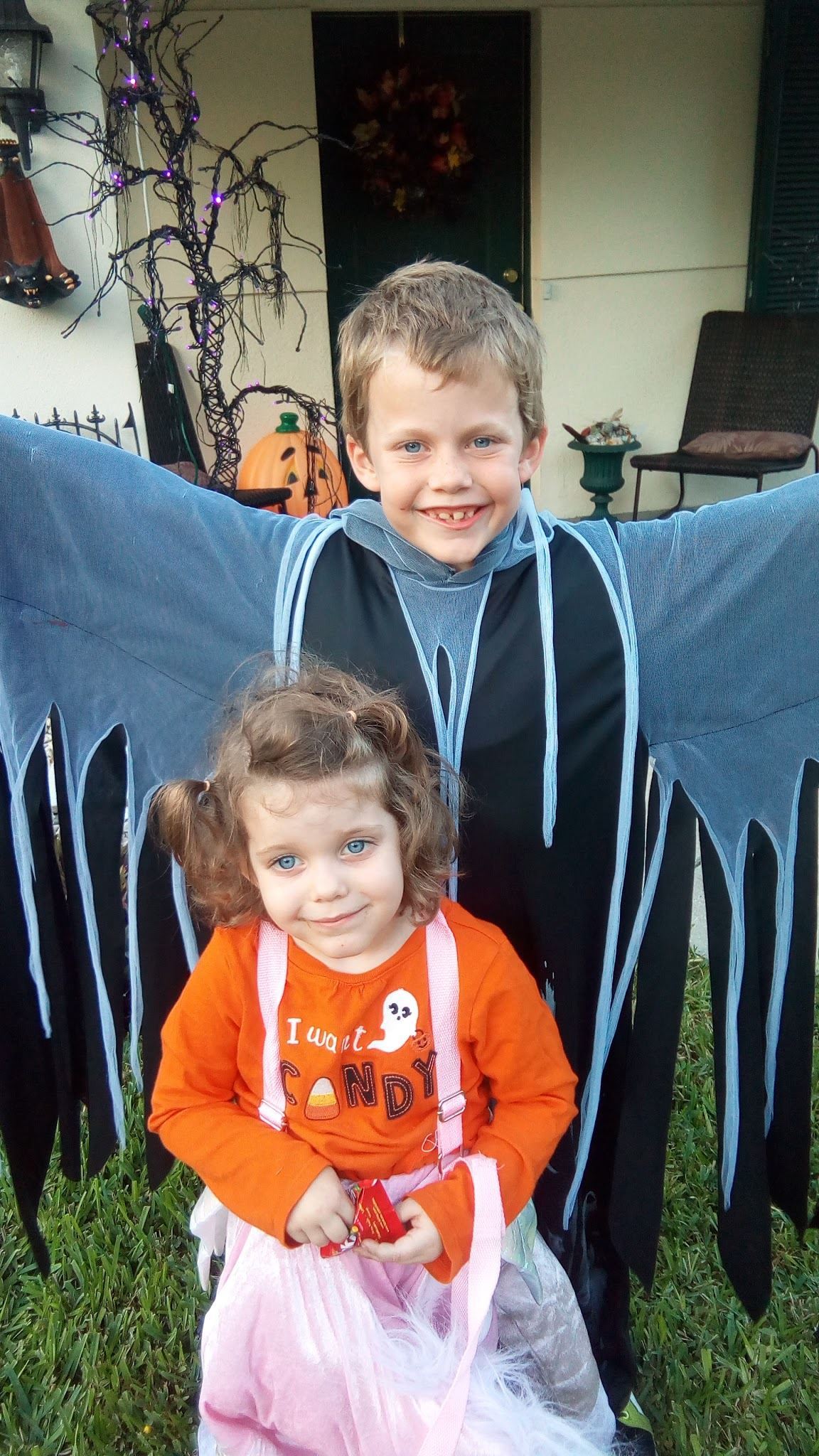 She doesn't look very wicked before trick or treating with her brother.